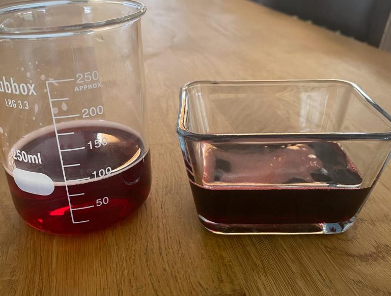 Red multifruit juice concentrate and diluted sample shown in laboratory glassware, illustrating color intensity and appearance at different Brix levels.