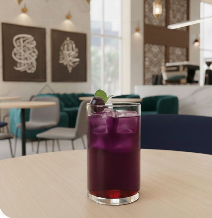 Red grape iced drink served in a modern coffee shop, ideal for fruit-based café beverages.