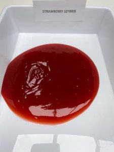 Strawberry Purée Concentrate 32° Brix – industrial fruit ingredient with homogeneous red texture and medium viscosity